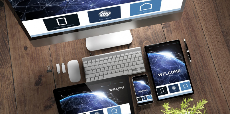 3d rendering top view of devices with landing page responsive on screen on wooden desktop. Some elements furbished by NASA.
