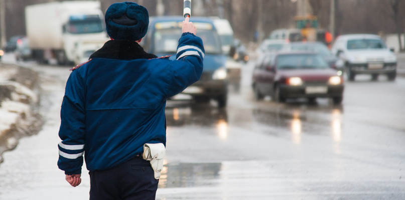 Inspector of traffic police regulates the movement of transport. Traffic policemen, Police, DPS